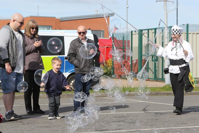 One young visitor looked delighted by the bubble entertainment.