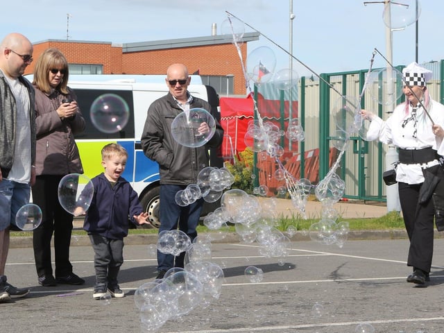 One young visitor looked delighted by the bubble entertainment.