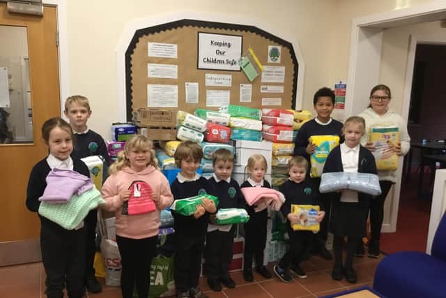 Pupils at Gateford Park Primary, in Worksop, with some of the donations.