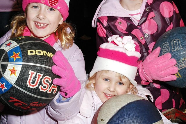 Worksop Rugby Club bonfire. Pictured - Emily Morvan, Natasha Binney and Laren Binney try their hand on the basketball game in 2006.