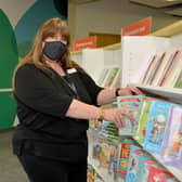 ally Kirk busy restocking the shelves ready for the reopening of Worksop Library.