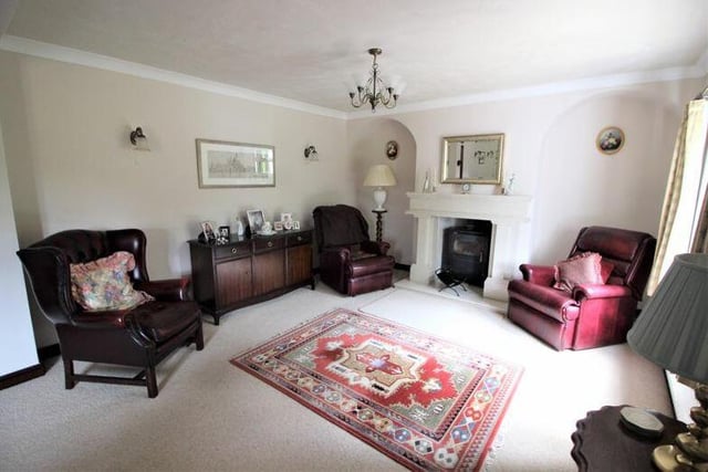 Let's start our tour of the Ollerton cottage in the lengthy lounge, which features a marble fireplace with log-burner.