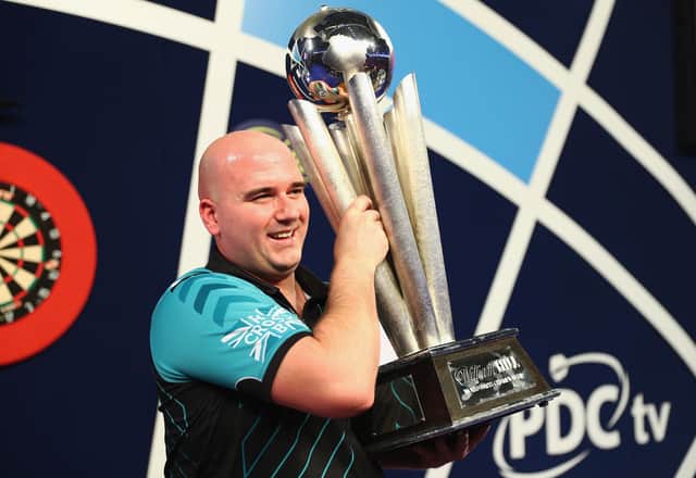 Rob Cross won £400,000 after winning the 2018 PDC World Darts Championships to complete a stunning transformation from 12 months ago. (Photo by Naomi Baker/Getty Images)