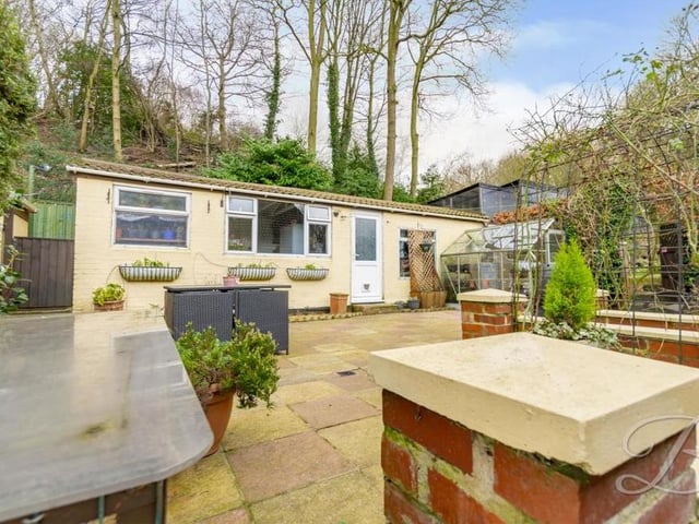 This photo shows the unusual but very useful space in the garden. There's certainly plenty going on!