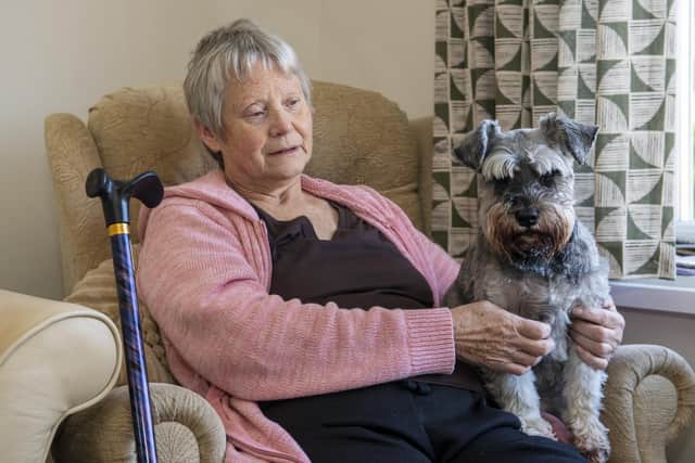 MS sufferer Elaine Cleaver has had her mobility scooter stolen from outside her Blyth home. Elaine is pictured with her dog Betty.