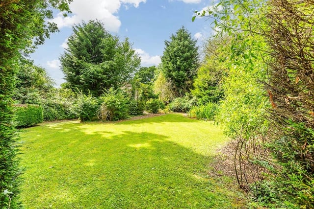 The separate garden boasts large grassed areas.