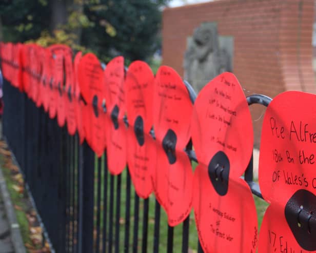 Worksop residents gathered to pay their respects at the Remembrance Sunday event with messages to loved ones lining the streets on poppies