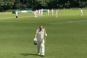 Dave Beard leaves the field after scoring 87 runs.