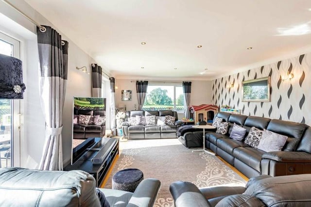 A second look at the sitting room or living room, which is so bright and spacious. It is probably the pick of the four reception rooms at the £699,995 property.