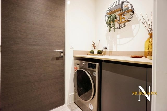 Just off the kitchen is this convenient utility room, with space for a washing machine.