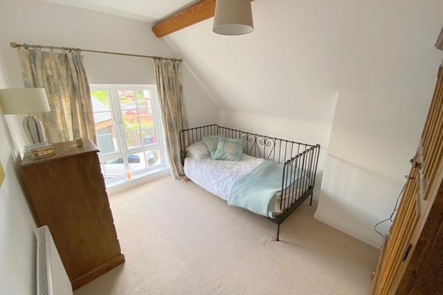 The third bedroom is the smallest, but it is still an enchanting space, with room for storage. The window overlooks the front of the property.