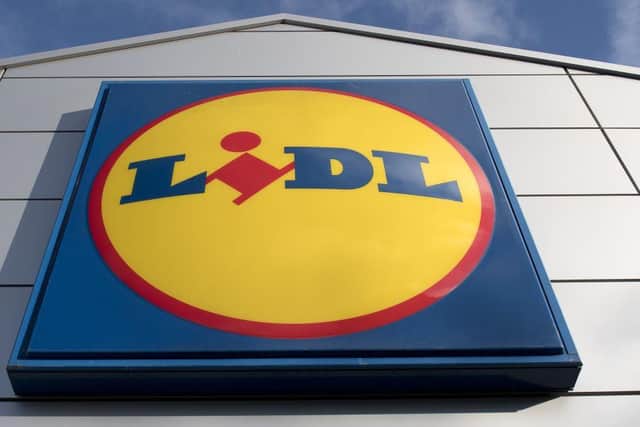 Signage is pictured at a branch of Lidl supermarket (Photo by JUSTIN TALLIS/AFP via Getty Images)