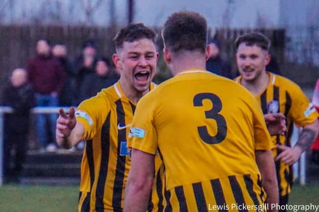 Rhodes celebrates with Max Pemberton after scoring against Market Drayton Town. Pic by Lewis Pickersgill