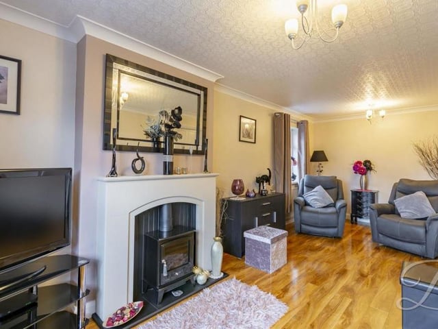 Cosy and relaxing is the only way to describe the living room, where you can just imagine settling down in front of the fire and the TV. Traditional coving adds another homely touch