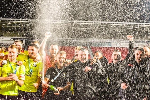 Worksop Town's players celebrate winning the Sheffield and Hallamshire Senior Cup.