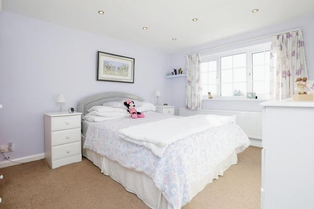 Moving upstairs, it's time to take a look at the bedrooms. The master  is a spacious double that overlooks the front of the house. It has access to an en suite bathroom, which comprises an enclosed shower cubicle, wash hand basin and WC, with spotlights and fully tiled walls and floor.