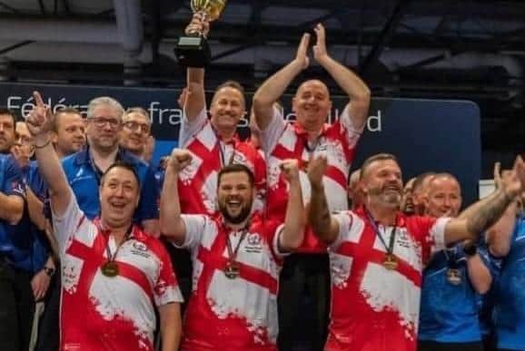 Kev Seaman and his England Seniors team mates celebrate their world title