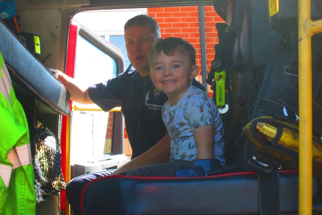 Big smiles from Nico in the fire engine.
