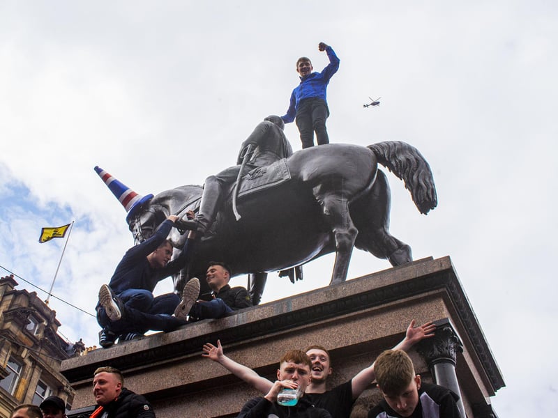 Rangers fans also clambered on statues in George Square