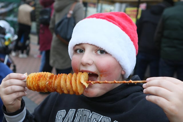 Noah Gresham tucked into festive street food.