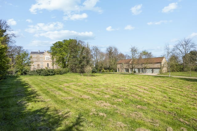 This photo shows how the cottage sits in relation to the main house. Nearby is a two-acre private, walled orchard, while the grounds also include a block of five stables, a large garage and an outside toilet.