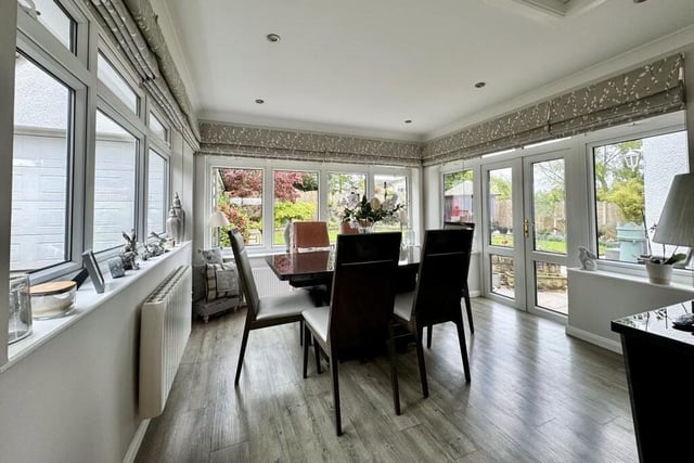Attached to the kitchen is this ultra-bright breakfast room or dining area. French doors open out on to the rear garden.