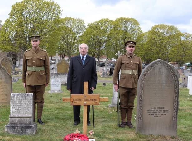 Robert Ilett standing behind the grave with the cross installed, flanked by the two men in authentic Notts and Derby Regiment uniforms of 1918.