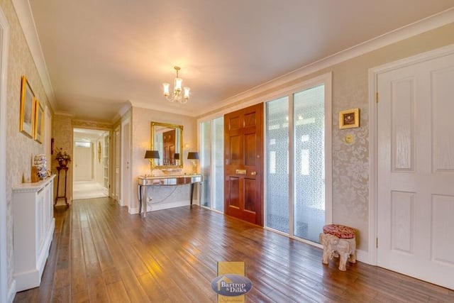 The elegant entrance hallway sets the tone for the rest of the £700,000 Worksop bungalow. Its wooden floor leads to the main reception rooms and kitchen.