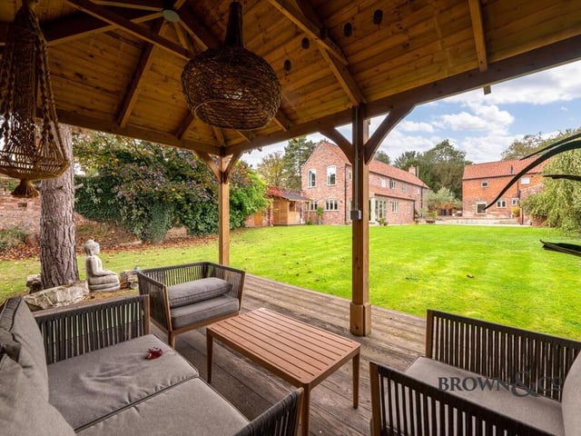 Looking down the garden to the property from its summer house.