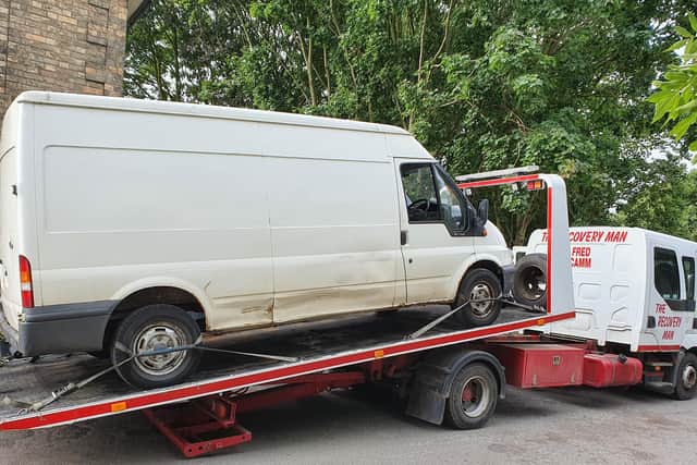 This photo shows a transit van being towed away after being caught on camera while being used to fly tip in Bassetlaw