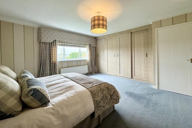 As well as extensive wardrobe space, a dressing table and bedside drawers, the master bedroom has access to a fully fitted, walk-in dressing room.