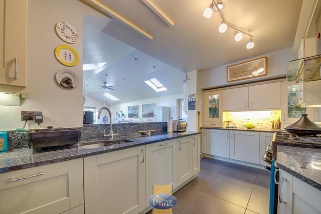 The first port of call on our tour of the £495,000 Worksop home is this modern kitchen, which boasts a good range of high-quality, fitted wall and base units, with granite work surfaces.