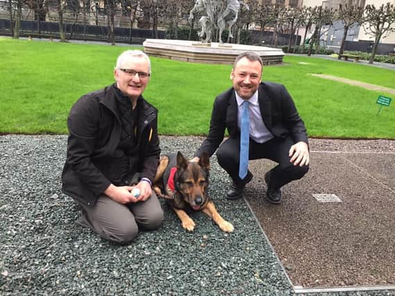 Brendan Clarke-Smith (right) with PC Dave Wardell and Finn the dog.