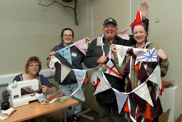 Queen's Diamond Jubilee activities at Clumber Park. The bunting making workshop trying to beat the previous world record. Pictured from left volunteer Ceinwen Edwards, volunteer programme manager Annie Beethell, visitor services Phil Whiteley and community involvement officer Heather James. (w120606-3a)