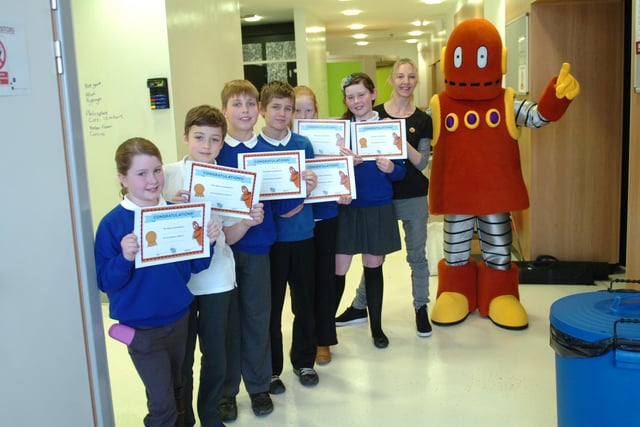 Jesmond Gardens School pupils (left to right) Kate Sorby, Liam Robinson, Kieran Rafferty, James Withycombe, Paige Cannon, Ellie Cuthbert,with Brainpopper Jude Baker and the Brainspace robot. Does this bring back memories?