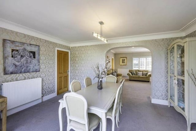 That lounge archway leads to this delightful dining room, which has coving to the ceiling and a central light point.