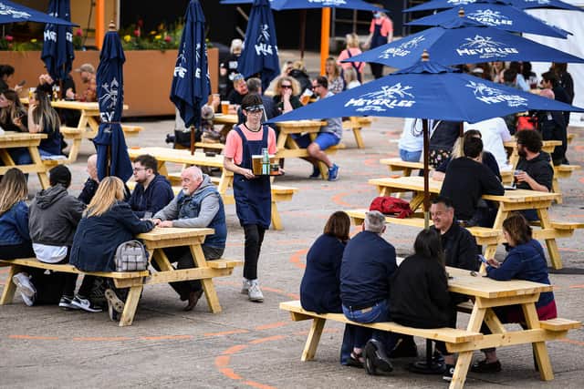 Drinkers enjoy their time in a beer garden (Photo by Jeff J Mitchell/Getty Images)