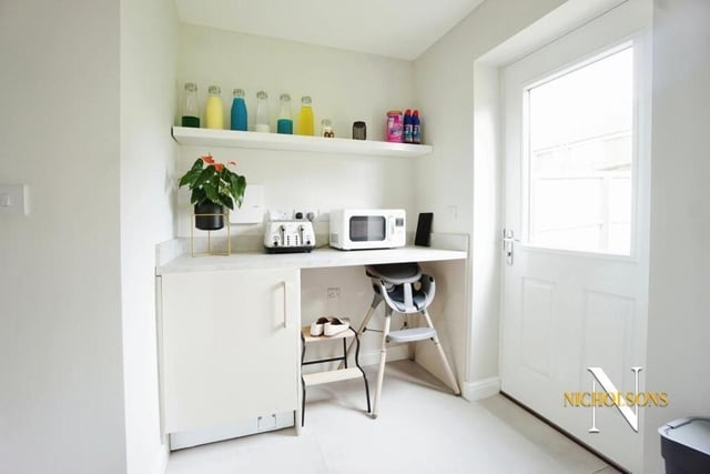 This handy utility room sits just off the open-plan kitchen.