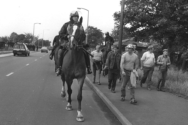 Another photograph showing police and miners in Harworth on August 8, 1984.