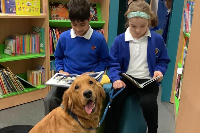School dog Nala with students in the newly refurbished library.