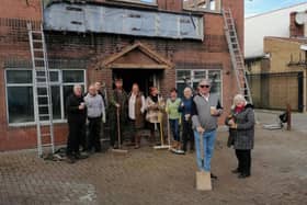 A number of business owners have come together to tidy up Laughton Road in Dinnington, and board up a burnt-out building.