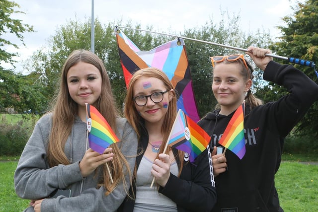 April Garner, Demi-Lea Hill and Phoebe Leaske waved the progressive Pride flag.