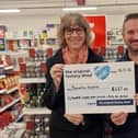 Manager of Langold's The Original Factory Shop, Avi Goldman, presented Debbie Rawlings, of Bassetlaw Hospice, with the cheque.