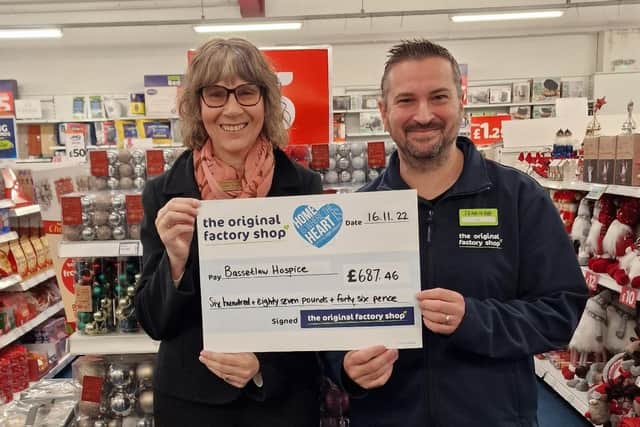 Manager of Langold's The Original Factory Shop, Avi Goldman, presented Debbie Rawlings, of Bassetlaw Hospice, with the cheque.