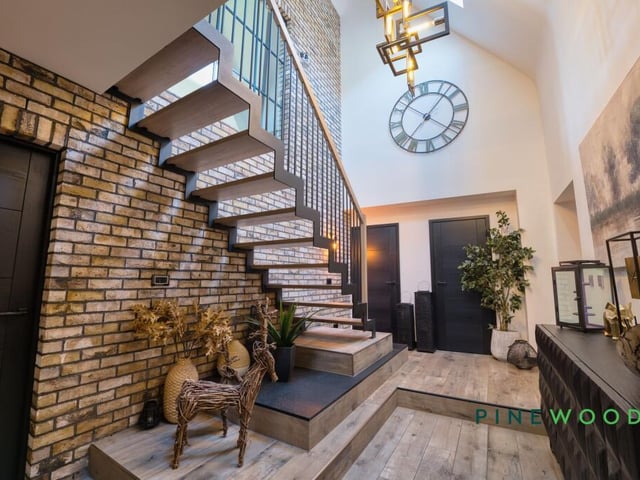 The stunning entrance hallway with staircase leading up.