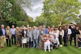 Esmeralda Simpson celebrates her 100th birthday, surrounded by family and friends.