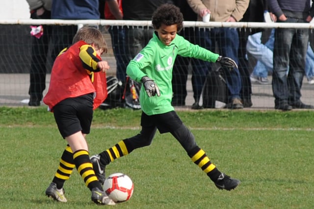 Not sure where the keeper is but hope he won the ball. The match is Worksop Town FC vs FC United of Manchester at a Junior football tournament.