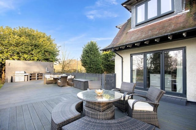 This decked seating area is a lovely spot in which to relax or entertain family and friends.