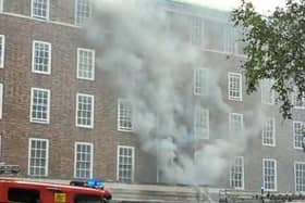 Smoke billows from County Hall during the fire in July.
