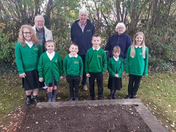 Back row are representatives of Worksop Rotary Club - Peter Swinscoe, Ken Thompson (president) and Clare Davis with children from Haggonfields Primary School.